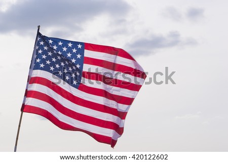United States Flag on Background of Sky