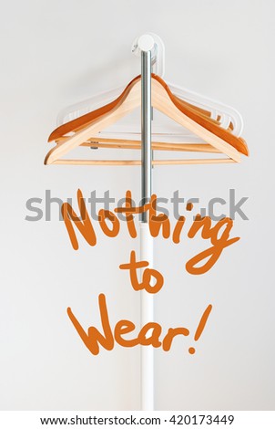 Nothing To Wear Design Concept Empty Wooden Coat Hanger Open Cloth Rail Grey Wall