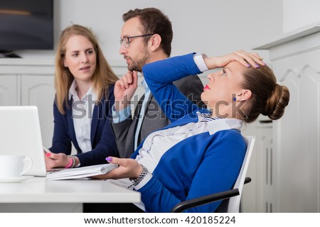 Dissatisfied businesswoman on a meeting  Royalty-Free Stock Photo #420185224