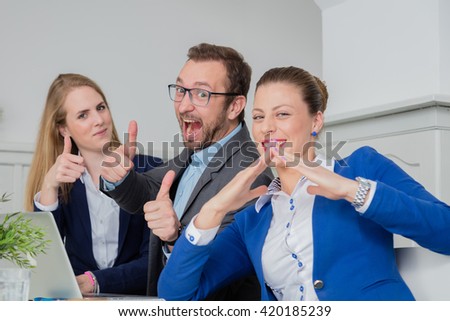 Satisfied team expressing business success  