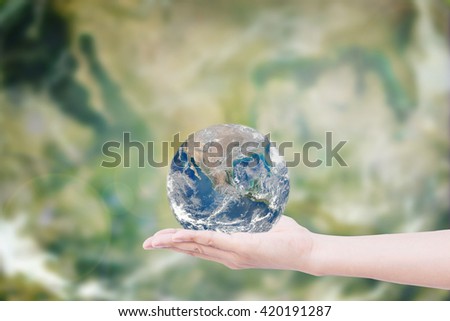 Hand giving the Earth. CSR save the earth. Elements of this image furnished by NASA. World Environment Day