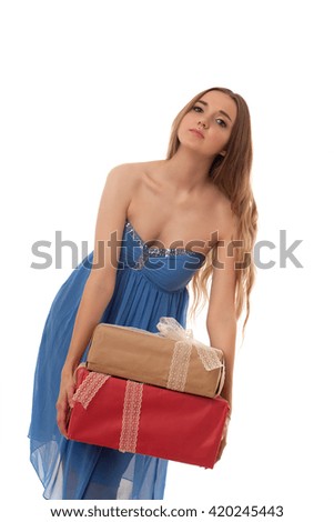 young beautiful girl in blue dress with gift boxes in hand isolated on white background