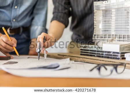 architecture drawing on architectural project, teamwork Concept Royalty-Free Stock Photo #420271678