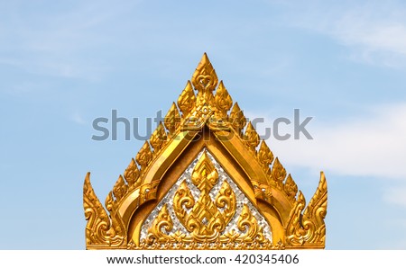 Roof gable Golden Thai style temple. Royalty-Free Stock Photo #420345406