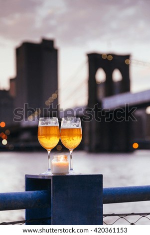 Brooklyn Bridge at candle champagne glasses twilight in New York City