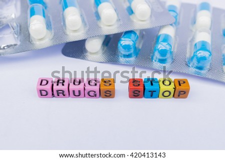 Drugs Stop (colorful cubes words series) with blurred background