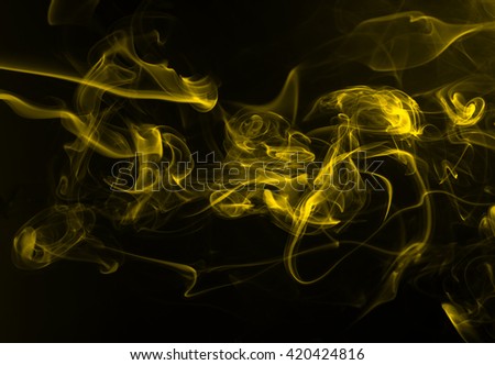 Movement of yellow smoke, darkness concept