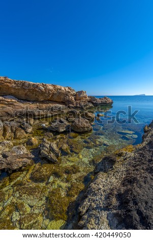 Rocky beach in Mykonos, Cyclades, Greece.