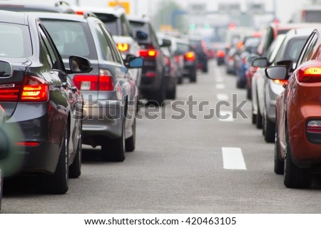 Cars on highway in traffic jam Royalty-Free Stock Photo #420463105
