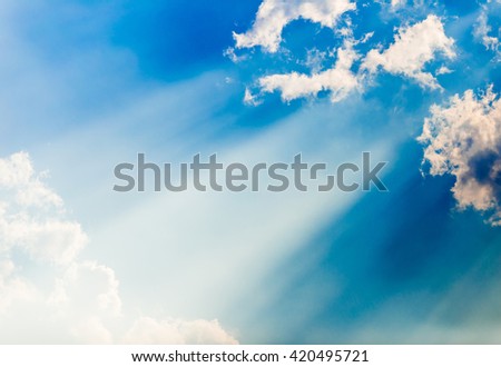 Beautiful background - sky blue, bright sun shines through clouds