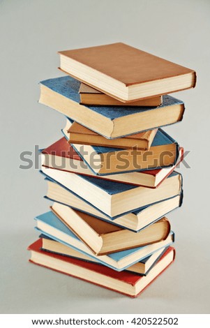 Stack of  books on grey background