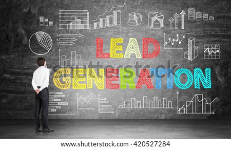 Lead generation concept with businessman looking at business chart and diagrams on chalkboard