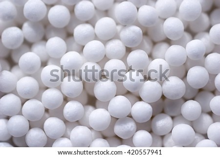 Background with spherical homeopathic pills closeup