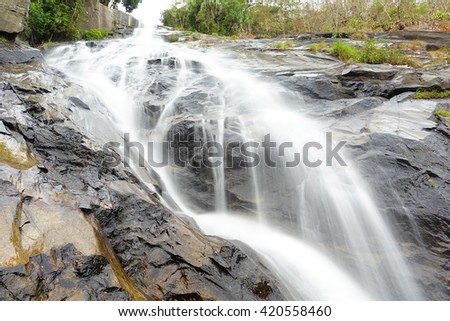 Ton Pliw waterfall at Songkhla Southern Thailand,long exposure-water motion blurred:Select focus with shallow depth of field.