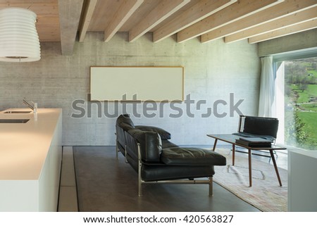 Interior of a modern chalet in cement, living room