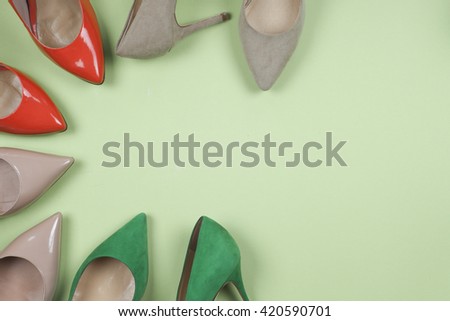 picture of different shoes, Shot of several types of shoes, Several designs of  women shoes. Leather Shoe. Pile of various female shoes on  light  background. Copy space for text.