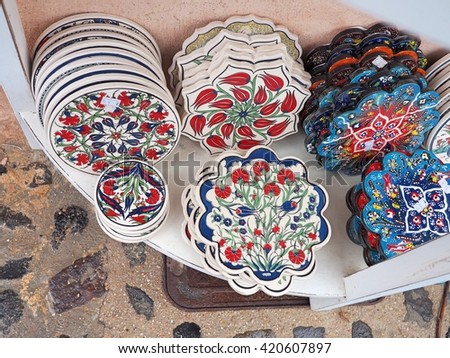 colorful painted dishes and coasters
