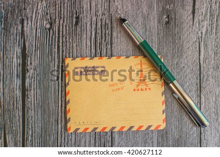 Mail concept with envelope and pencil. White page