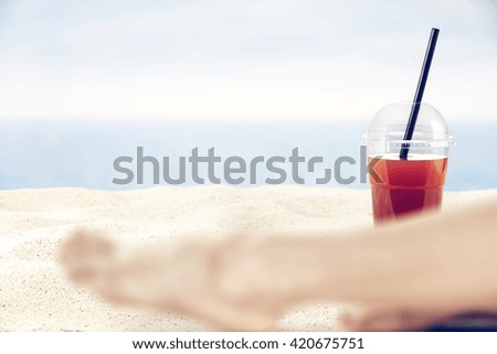 blurred summer sea and single drink 