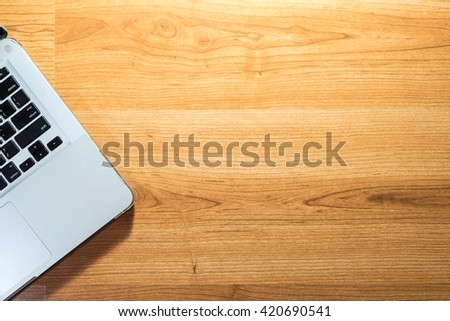 Top view of laptop on wood table - copyspace