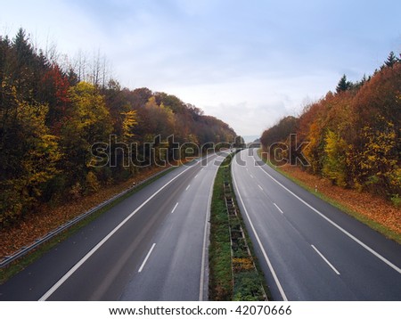 Empty German autobahn in the autumn evening Royalty-Free Stock Photo #42070666