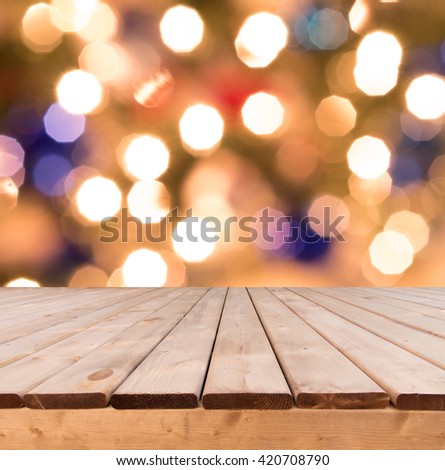 Wooden deck perspective in front of glitter colorful boked