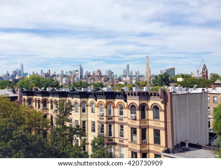Manhattan skyline from Park Slope, Brooklyn in New York City with row homes in the foreground