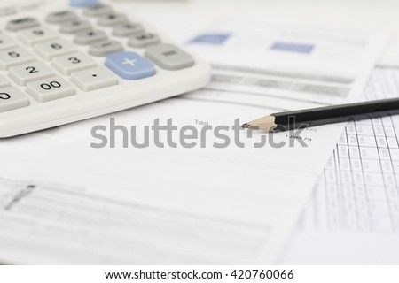 Utility energy bill and calculator with pencil, Bill and saving concept Royalty-Free Stock Photo #420760066