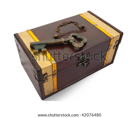 Gold  key on closed treasure chest , isolated with clipping path