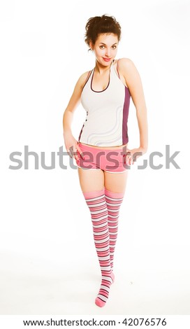Young beautiful woman in fitness. On white background.