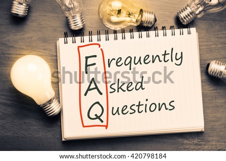 FAQ ( frequently asked questions ) text on notebook with many light bulbs Royalty-Free Stock Photo #420798184
