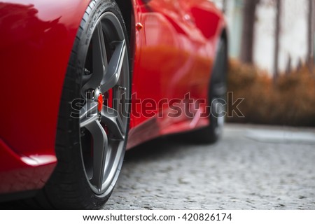 Super Sport Racing Car Detail on a Wheel and Red Breaks Royalty-Free Stock Photo #420826174