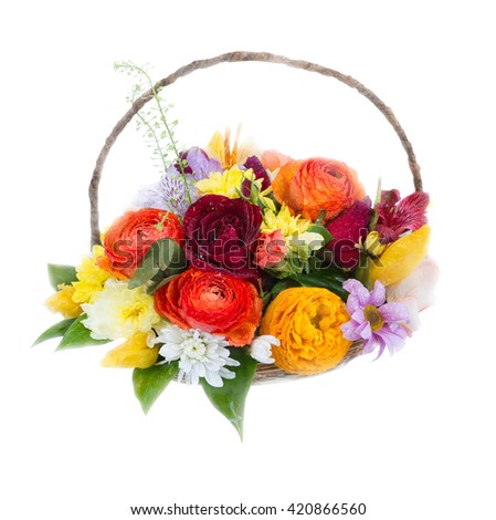 Different flowers in a small basket on a white background