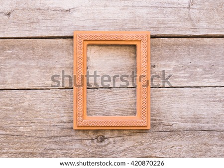 Wooden frame on the old shabby wooden wall