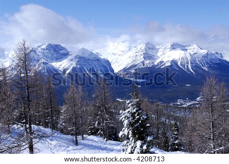 Snowy mountain ridges at Lake Louise in Canadian Rocky mountains