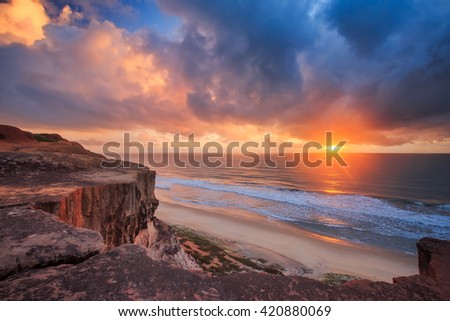 Cliff and Beach at sunrise, Brazil Royalty-Free Stock Photo #420880069