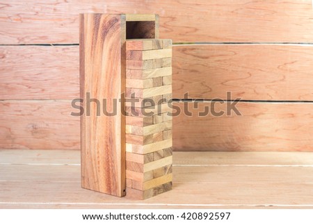 Blocks of wood in a box,on wooden background