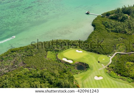 Aerial picture of Mauritius Island. Aerial view of golf course and lagoon in Mauritius