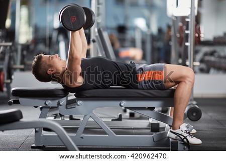 Man doing chest workout, bench press with dumbbells Royalty-Free Stock Photo #420962470