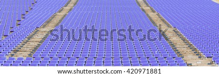 Pattern empty purple plastic grandstand seats with number