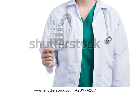 Young female doctor with pills. Tablets in blister package. Health care concept.
