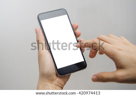Close up hand holding black phone on white clipping path inside. Royalty-Free Stock Photo #420974413