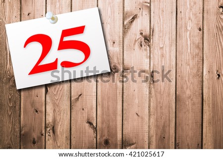 Text 25 on white short note paper. calendar on old wood background. Empty space for text.