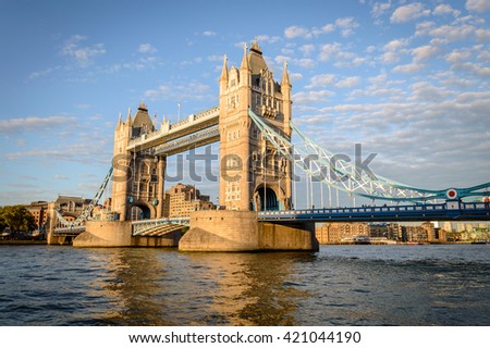 Tower Bridge in London, UK. Tower Bridge is a combined bascule and suspension bridge in London. The bridge crosses the River Thames close to Tower of London and has become an iconic symbol of London