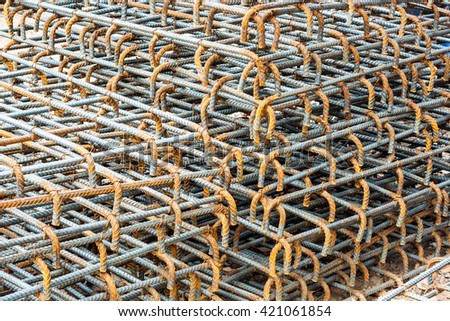 Steel rods or bars used to reinforce concrete.