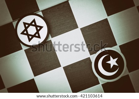 Draughts (Checkers) - Jadaism vs Islam - religious tension and conflict between two monotheistic religions and believers, jews and muslims (dramatic light: underexposure, vignetting) Royalty-Free Stock Photo #421103614