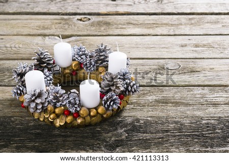 traditional advent wreath on weathered old wood table background
