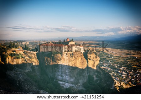 Monastery on the high rock in Meteora with panoramic view on the Thessaly valley, Greece - vintage hipster Instagram background