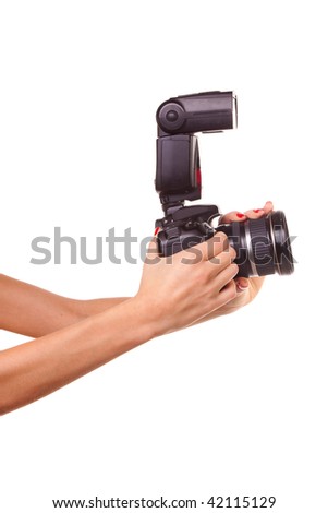 Women's hands holding the camera. Isolated on white.