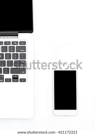 laptop and phone on a white background